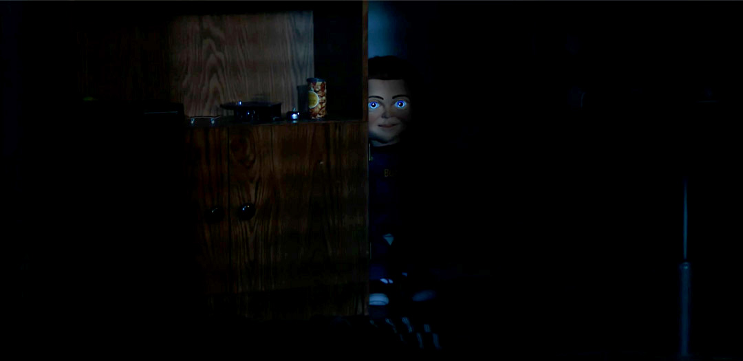 Chucky staring from the shadows